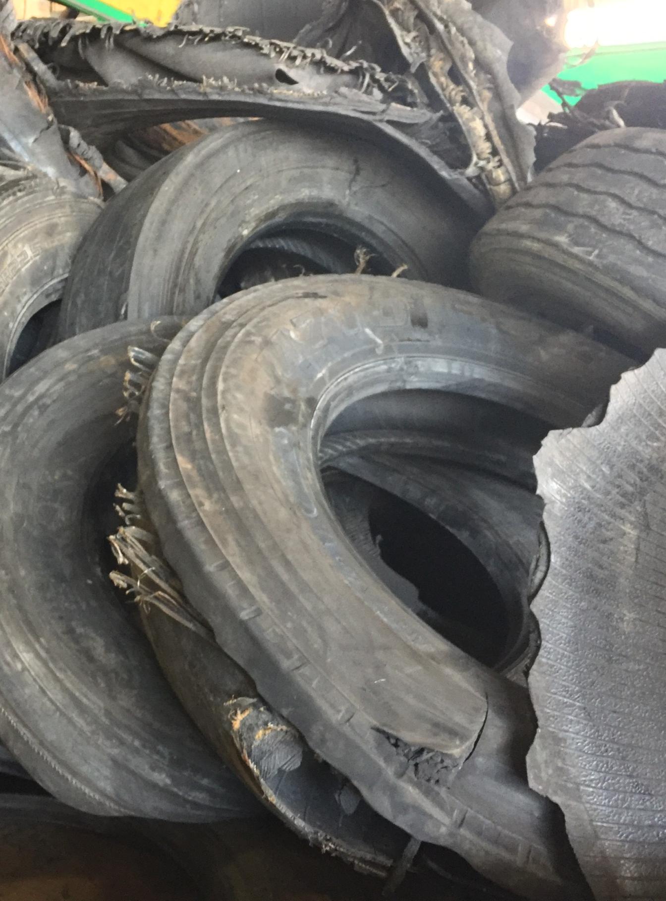 A stack of end of like commercial tires ready to be upcycled