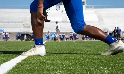 Football Player on Turf Field