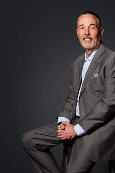 man posing on chair