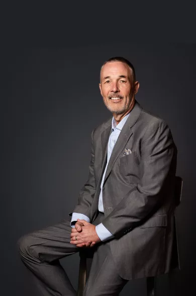 man posing on chair